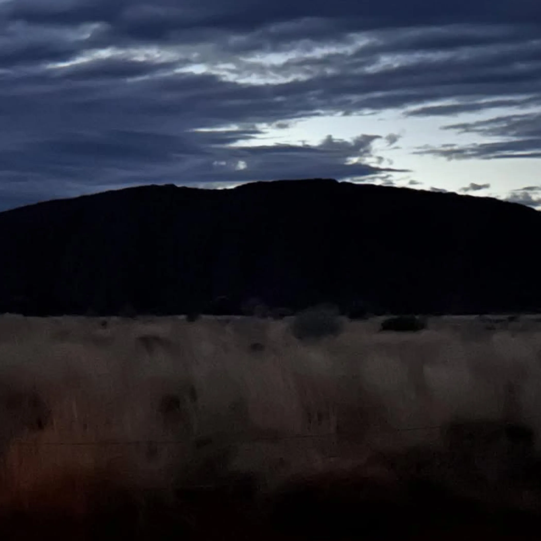 self drive car parked near uluru sunset